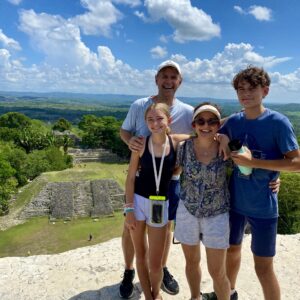 Logo of Virtuoso Family Travel with a family symbol.