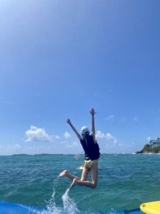 Logo of Virtuoso Family Travel with a family symbol.